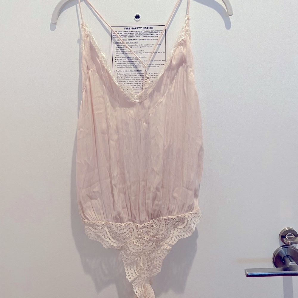 Free People light pink silk body suit